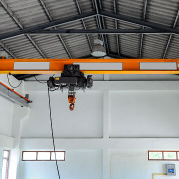 Small crane for lifting the machine in the factory.